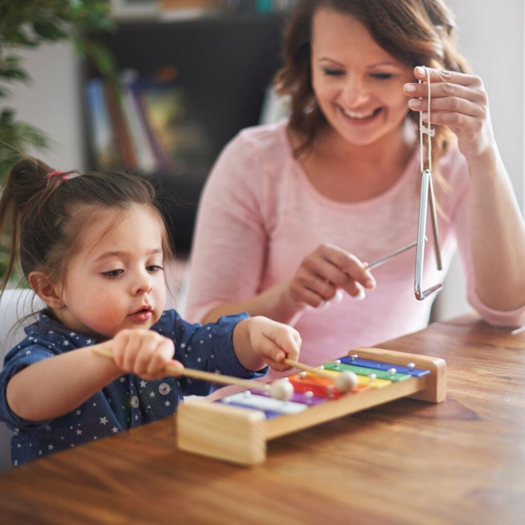 Child and Mother Playing Music